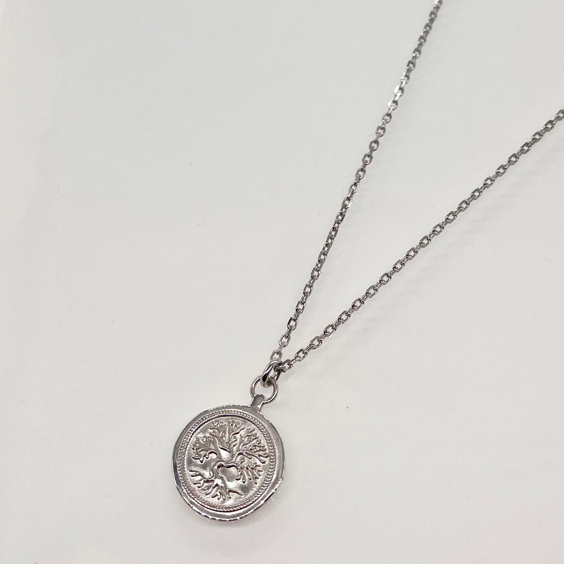 Collier médaille argent Racine 